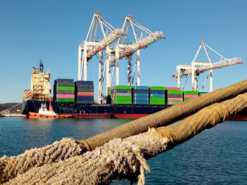 Logistics and transportation of container cargo ship and cargo with working crane bridge