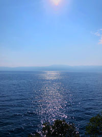 Scenic view of sea against blue sky