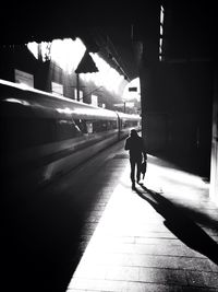 Woman walking in tunnel