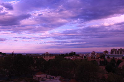 High angle view of buildings against sky during sunset