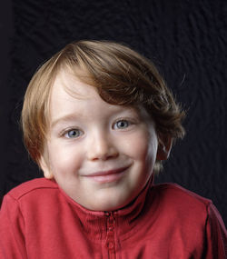 Close-up portrait of smiling boy