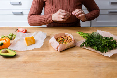 Man preparing food on cutting board at home