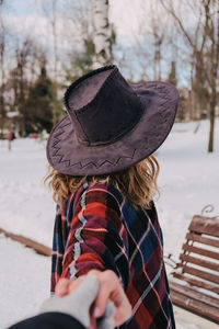 Midsection of woman wearing hat during winter