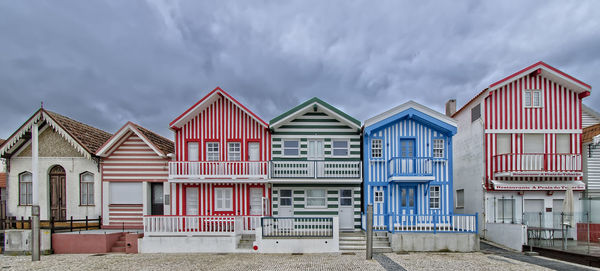 Houses on beach against sky