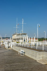 View of harbor against clear blue sky