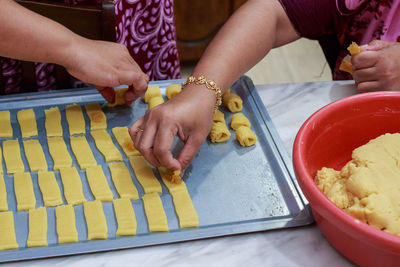 Midsection of woman preparing food