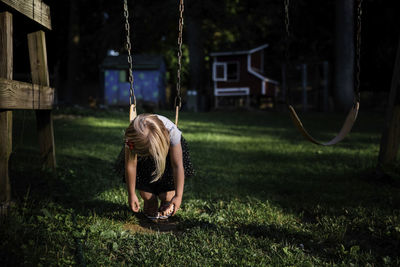 Girl swinging at playground