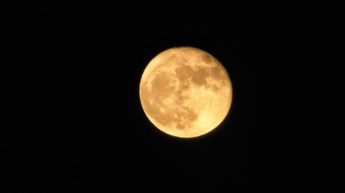 Scenic view of moon against black sky