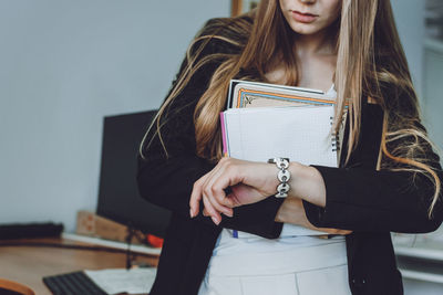 Young woman reading book