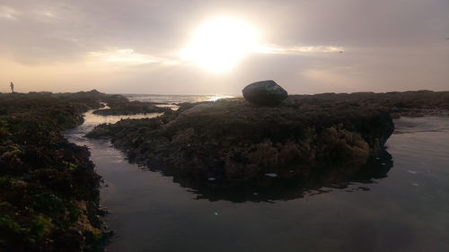 Scenic view of sea against sky during sunset