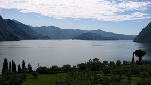 Scenic view of lake and mountains against sky