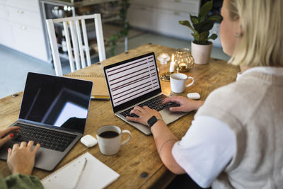 High angle view of women using laptops