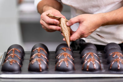 Close-up of man preparing food