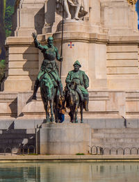 Statue in front of building