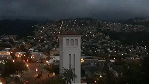 High angle view of illuminated buildings in city at night