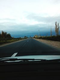 Road seen through car windshield