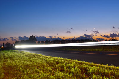 Scenic view of land against sky during sunset