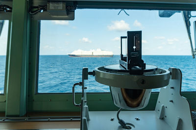 Scenic view of sea against sky seen through window