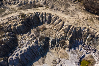 Industrial mining landscape from a drone. aerial view of abandoned open pit mine, nature pollution