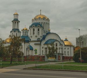 Exterior of church against cloudy sky