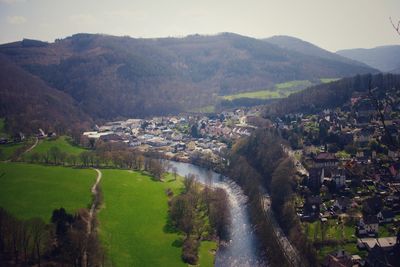 Aerial view of townscape against sky in city