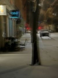 Blurred motion of car in city at night