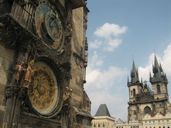 Low angle view of clock tower against sky