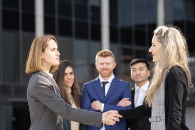 Portrait of smiling couple standing outdoors