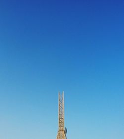 Low angle view of built structure against clear blue sky