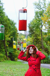 Young happy woman with red hair, freckles, blue eyes in beret in autumn park, smiling. lifestyle