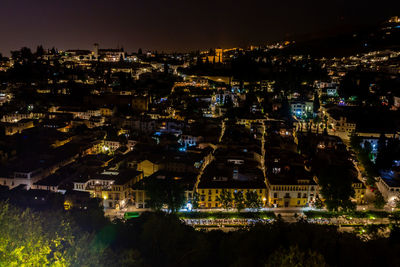 High angle view of illuminated buildings at night