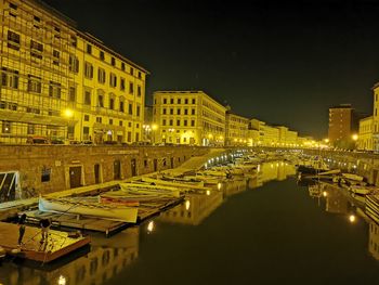 Illuminated buildings in city at night