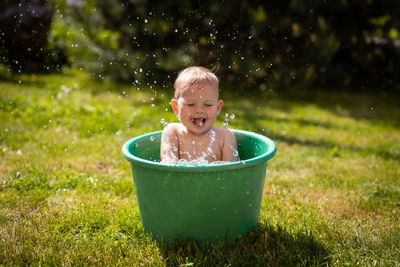 Portrait of smiling boy in water