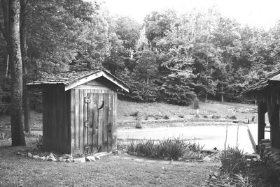 Wooden hut on grassy field