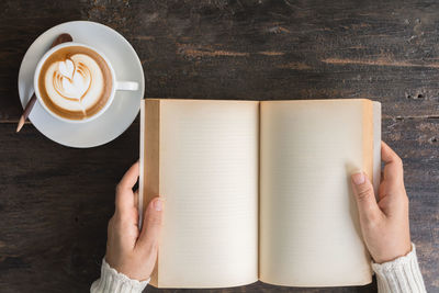 High angle view of coffee cup on table