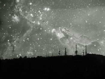 Scenic view of landscape against sky at night