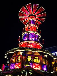 Low angle view of illuminated ferris wheel