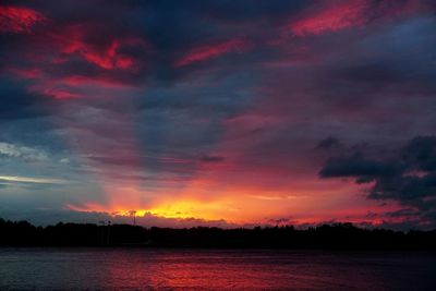 Scenic view of sea against romantic sky at sunset