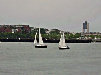 Boats sailing in river