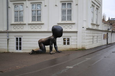 Full length of man in front of building