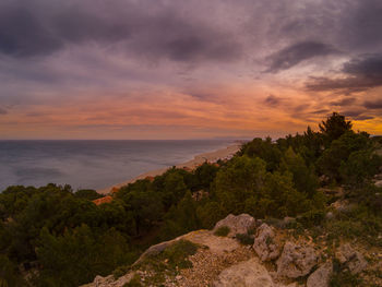 Scenic view of sea against sky at sunset