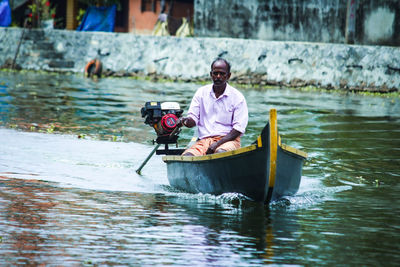 Man kayaking in lake