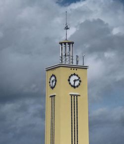 Low angle view of clock tower against sky