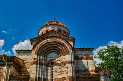 Low angle view of building against blue sky