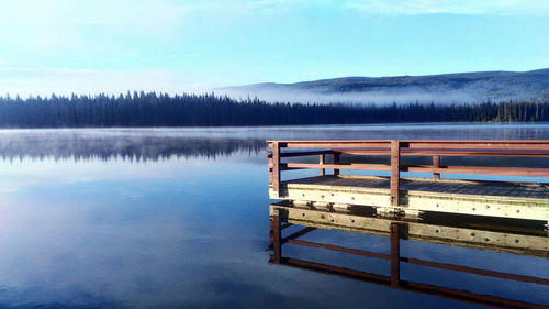 Empty pier over calm lake