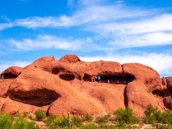 Rock formations on landscape against sky