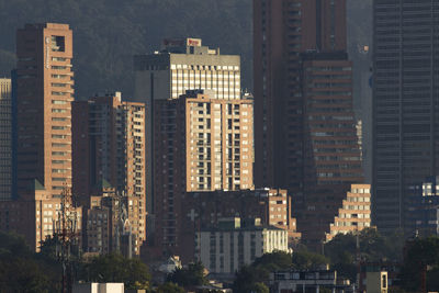 Modern buildings in city against sky