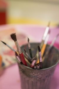 Paintbrush in stained container