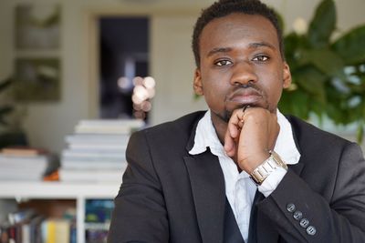 Portrait of businessman using mobile phone