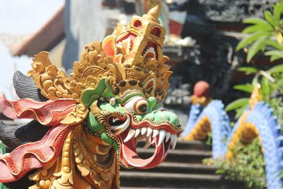 Close-up of statue against temple